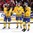 TORONTO, CANADA - JANUARY 5: Sweden's Jens Looke #24, Andreas Englund #6 and Sebastian Aho #2 look on after a bronze medal game loss to Slovakia at the 2015 IIHF World Junior Championship. (Photo by Andre Ringuette/HHOF-IIHF Images)